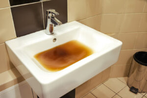 Clogged sink with dirty water